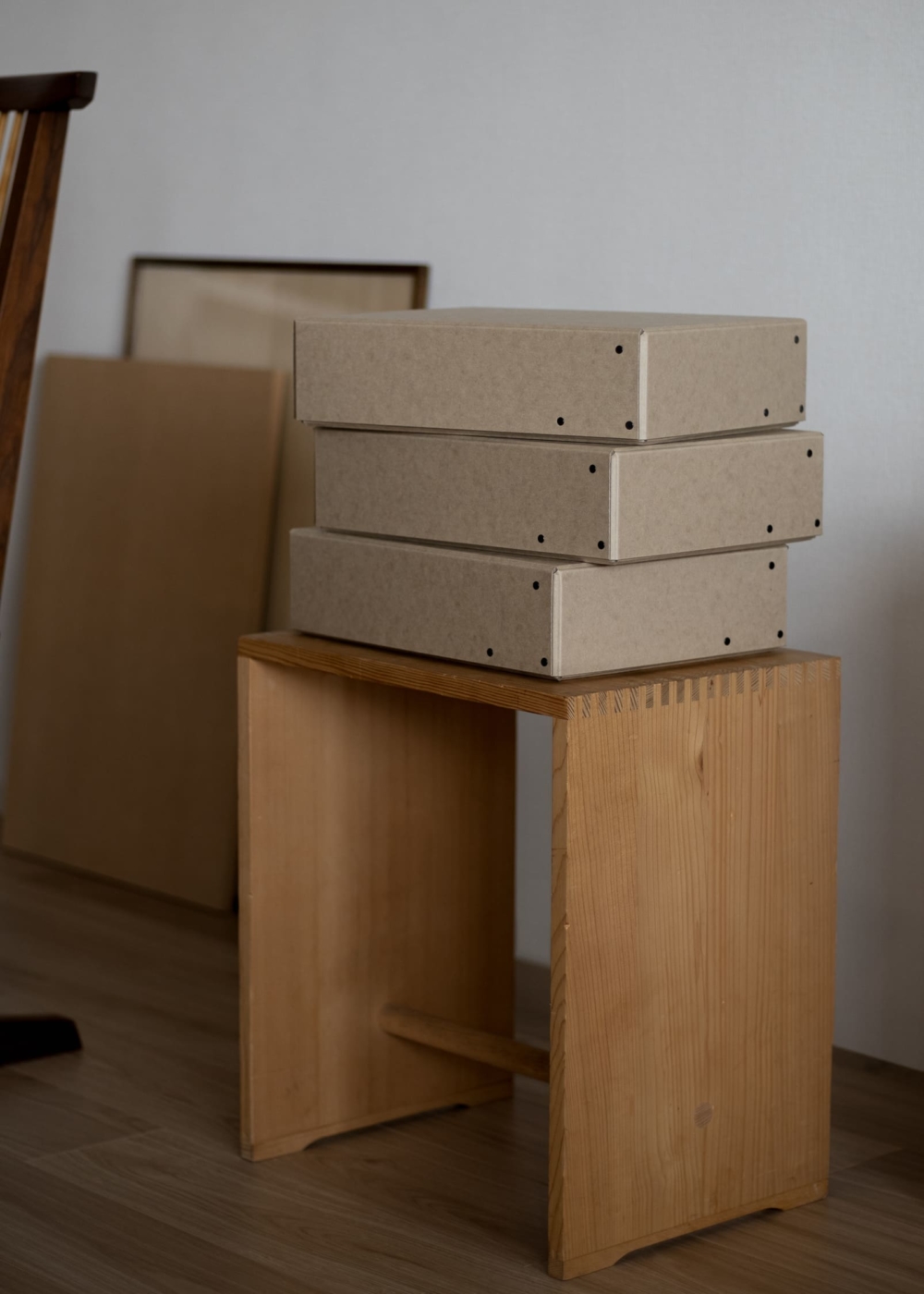FROME Archival storage box "Rivet Box" placed on Ulm Stool by Max Bill